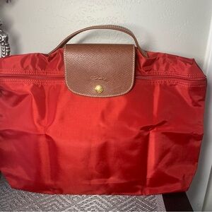 Longchamp Red and Brown Clutch with Sophisticated Design